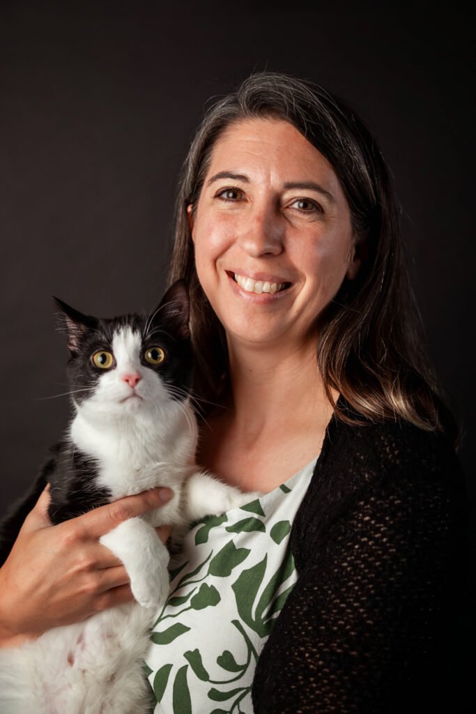 A women and a black and white cat